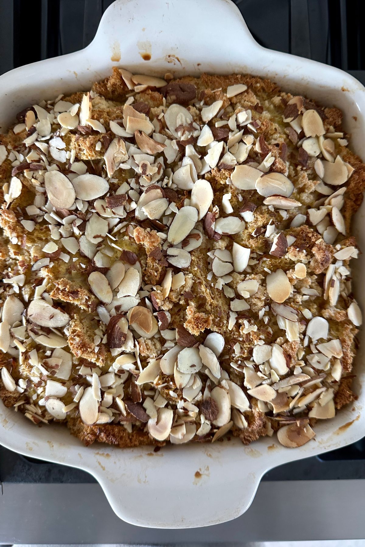 french toast casserole in a white baking dish 