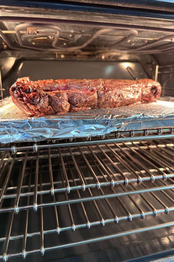 Beef tenderloin broiling in the oven.