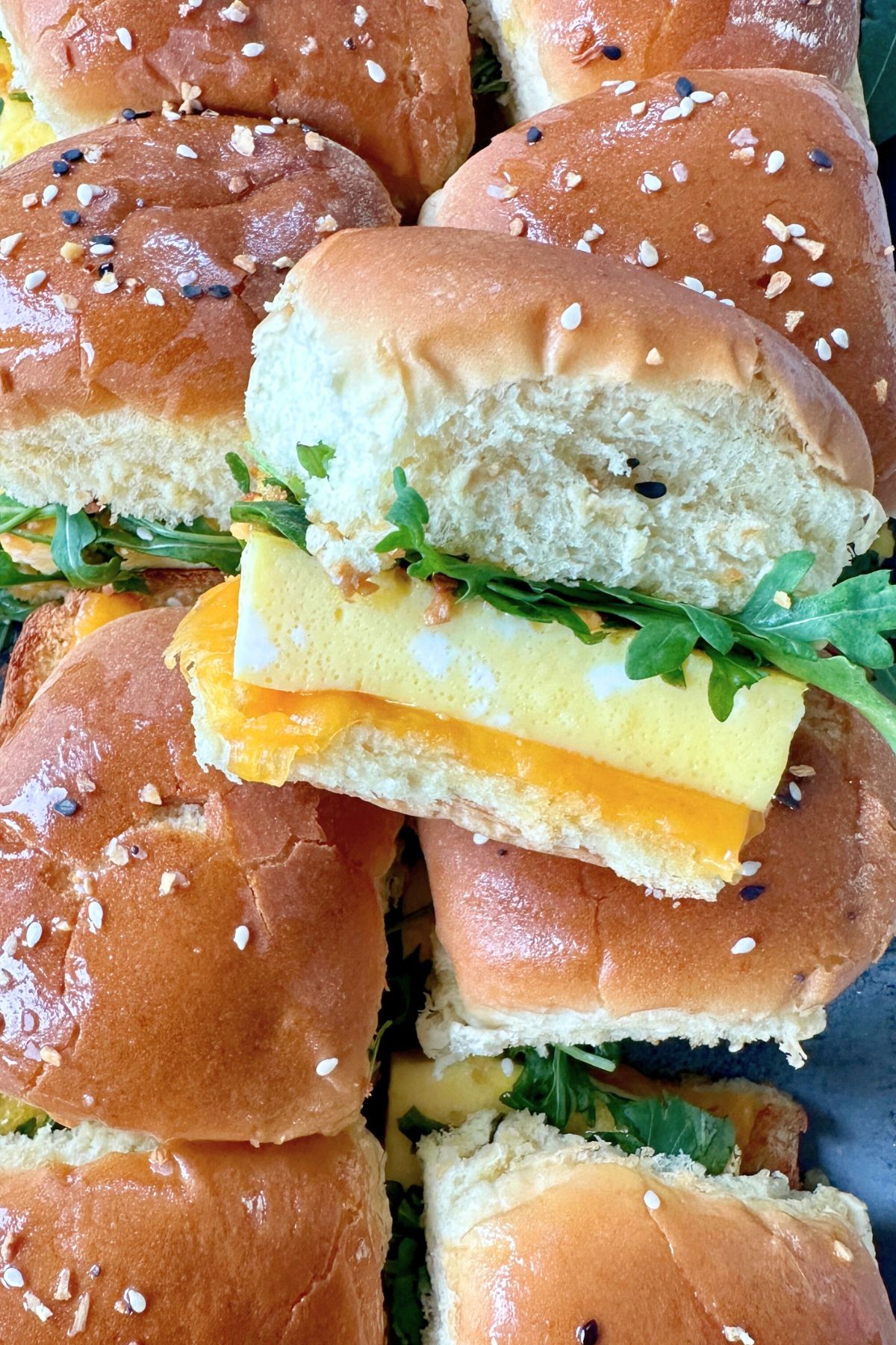 Close-up of a breakfast slider showing the layered ingredients.