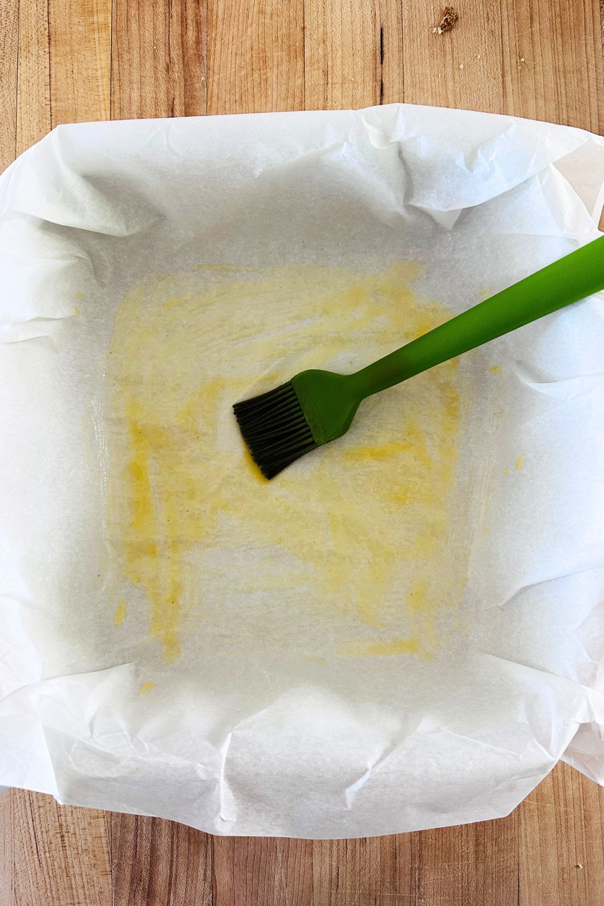 Parchment paper pressed into an 8 x 8 baking dish and brushed with melted butter.