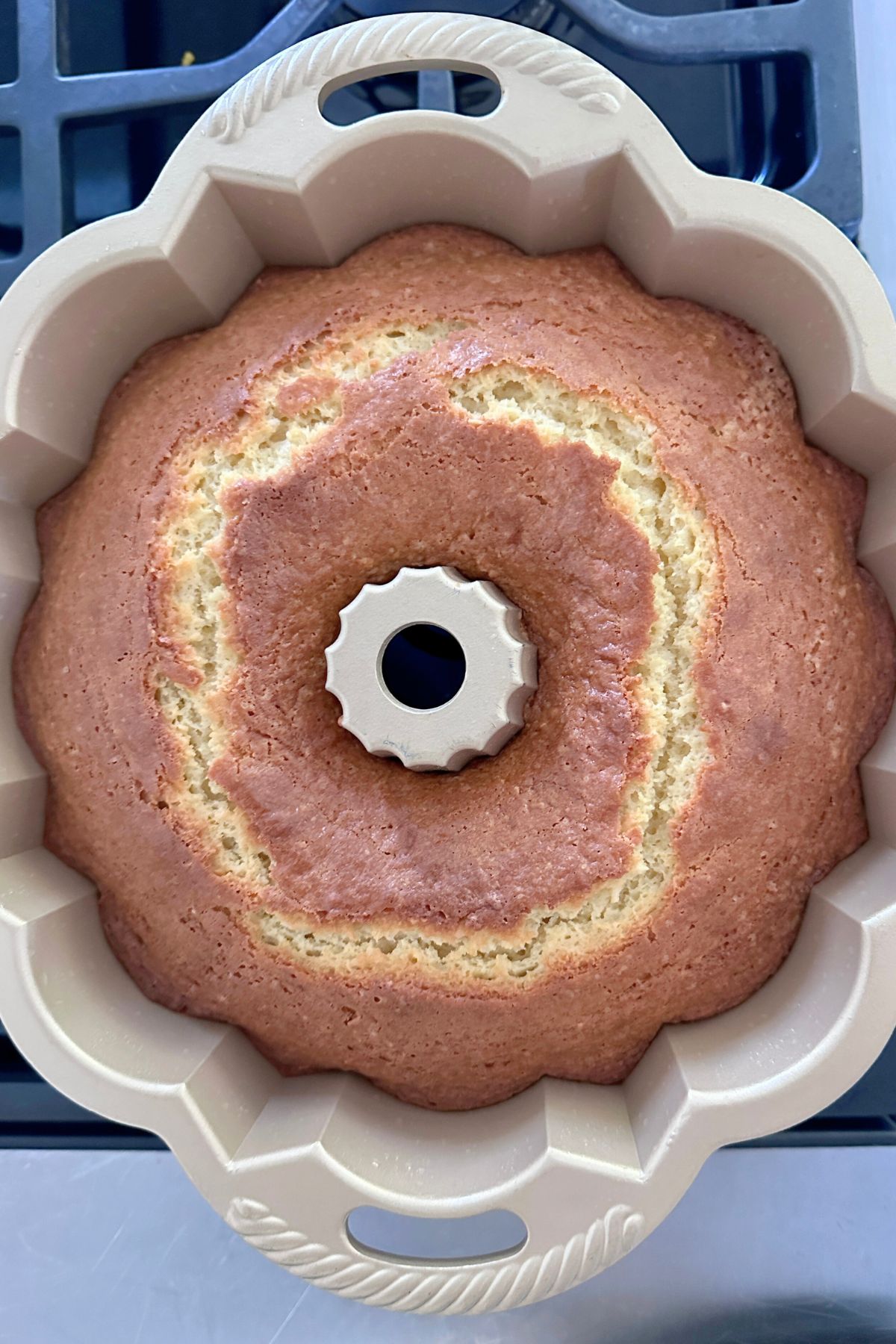 Baked coconut bundt cake showing a smooth top.