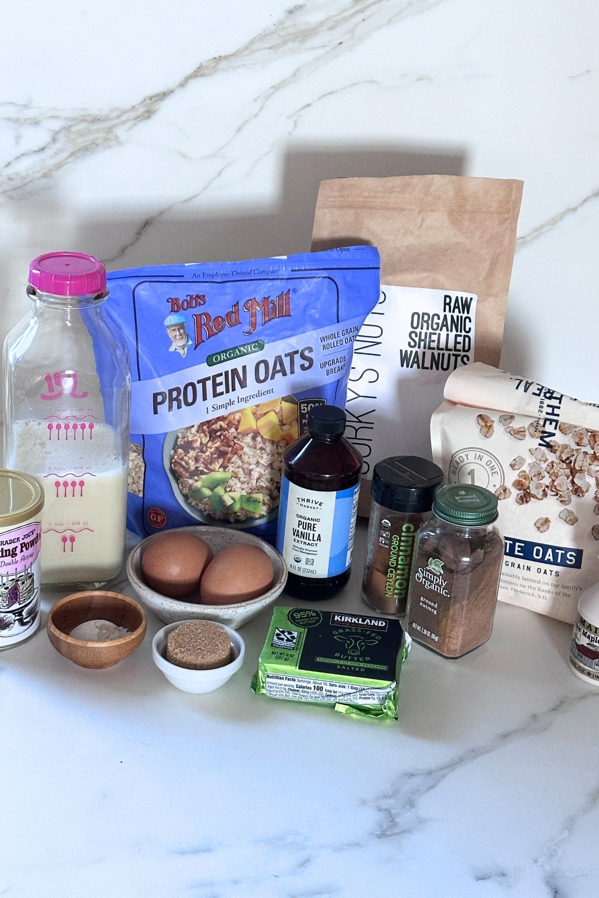 Coffee cake baked oatmeal recipe ingredients arranged on a white countertop. 