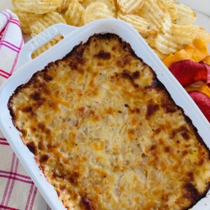 Hot onion dip in a baking dish.