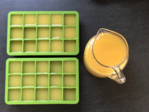 freezing orange juice in an ice cube tray