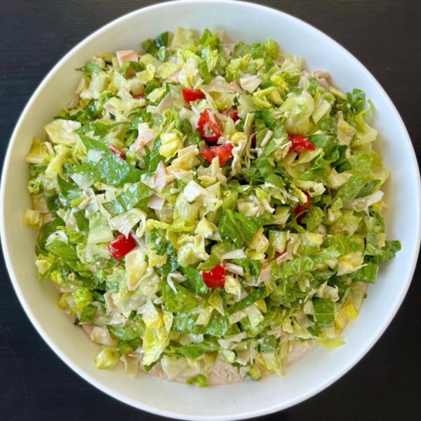 La Scala chopped salad plated with creamy white bean hummus base