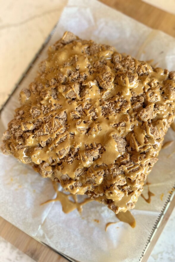Baked pumpkin coffee cake cooling on a wire rack, crumb set and golden.
