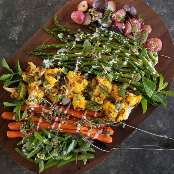 roasted spring vegetables on a cutting board
