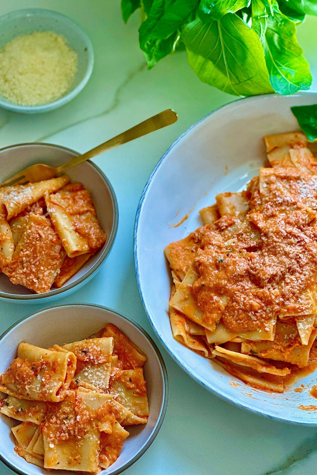 roasted tomato pasta garnished with parmesan cheese and served into bowls. 