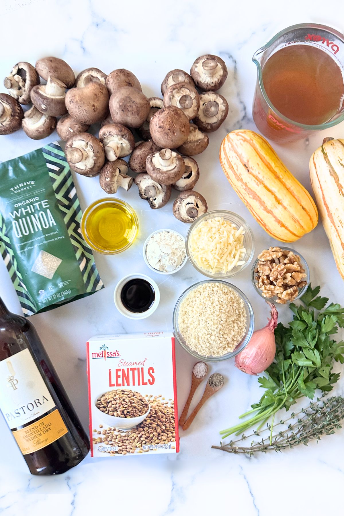 Stuffed delicata squash ingredients laid out on a countertop. 