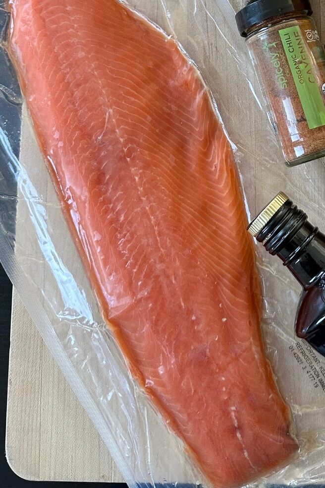 salmon resting on a cutting board