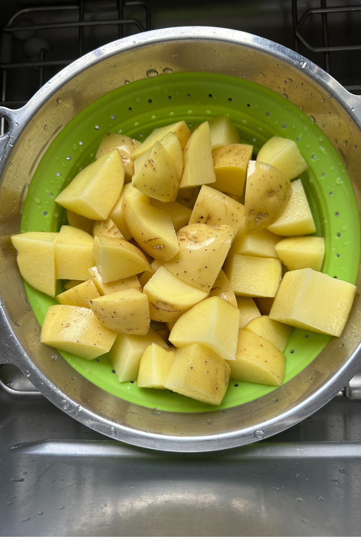 potatoes in a large bowl with seasonings 