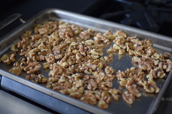 a sheet pan with toasted almonds on it. 
